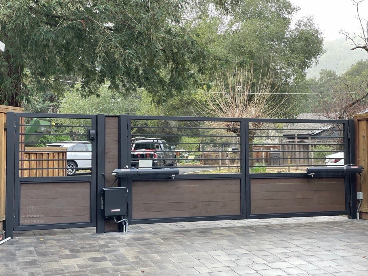 Dual swing gate with horizontal metal and wood panels powered by LiftMaster openers, installed by Automatic Gate Mates in Bay Area