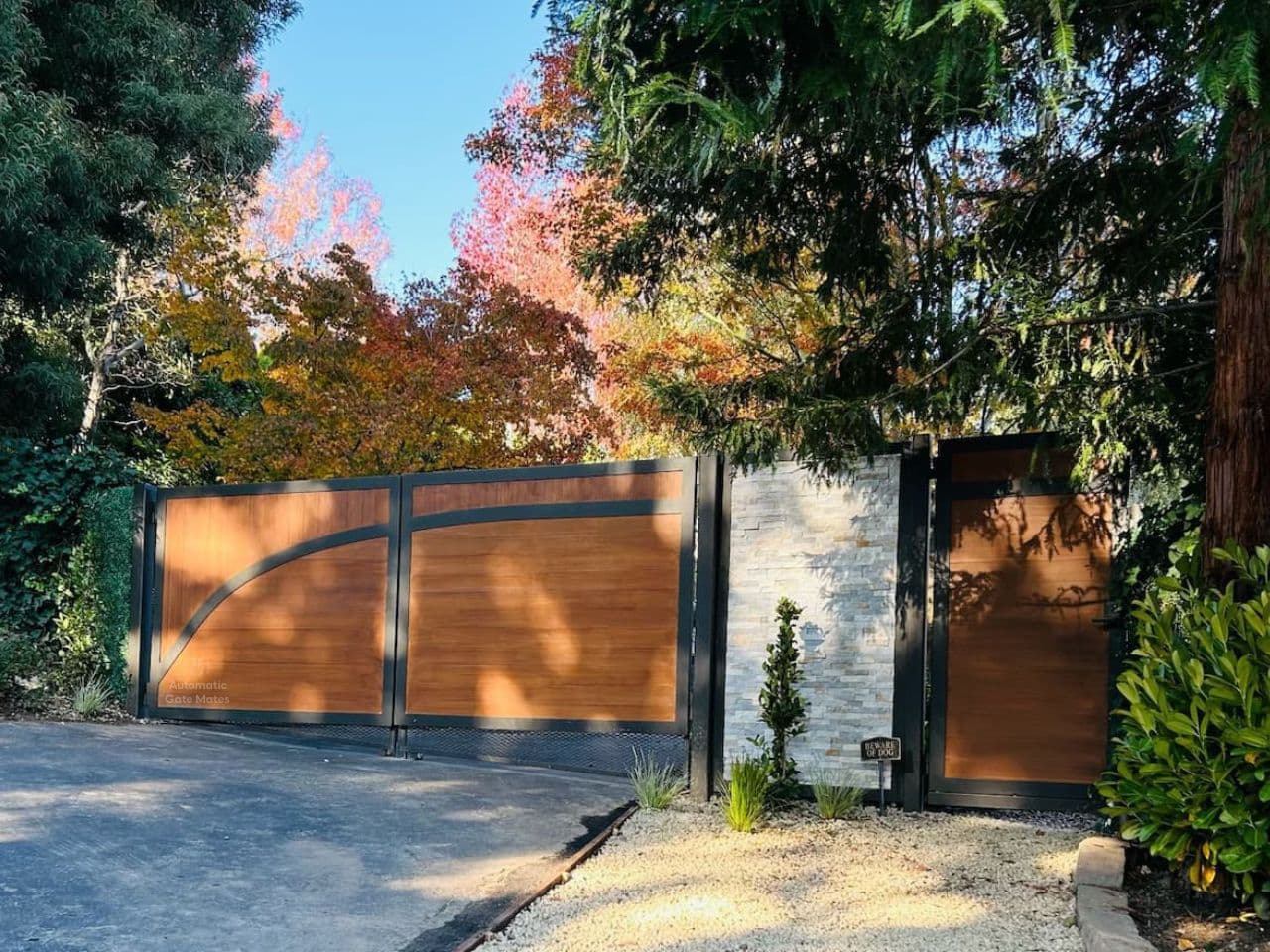 Modern horizontal black aluminum driveway gate installation in Bay Area by Automatic Gate Mates