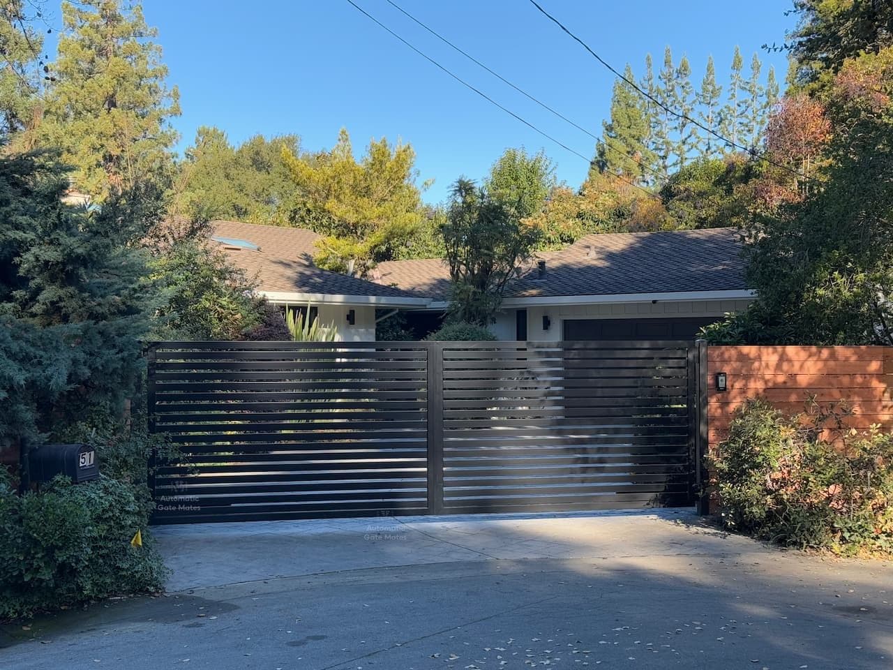 Modern horizontal aluminum driveway gate installation in Bay Area by Automatic Gate Mates